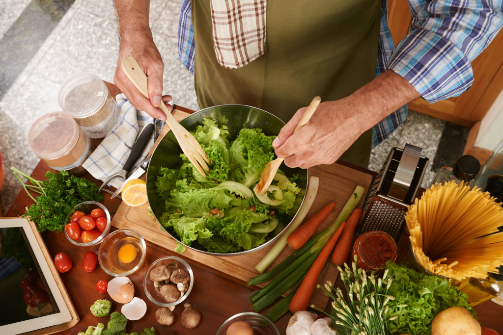 top-view-cropped-man-cook-apron-mixing-salad.jpg